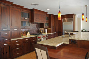 Beautiful kitchen with dark wood cabinets.
